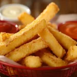 Crispy golden chicken fries served with dipping sauces.